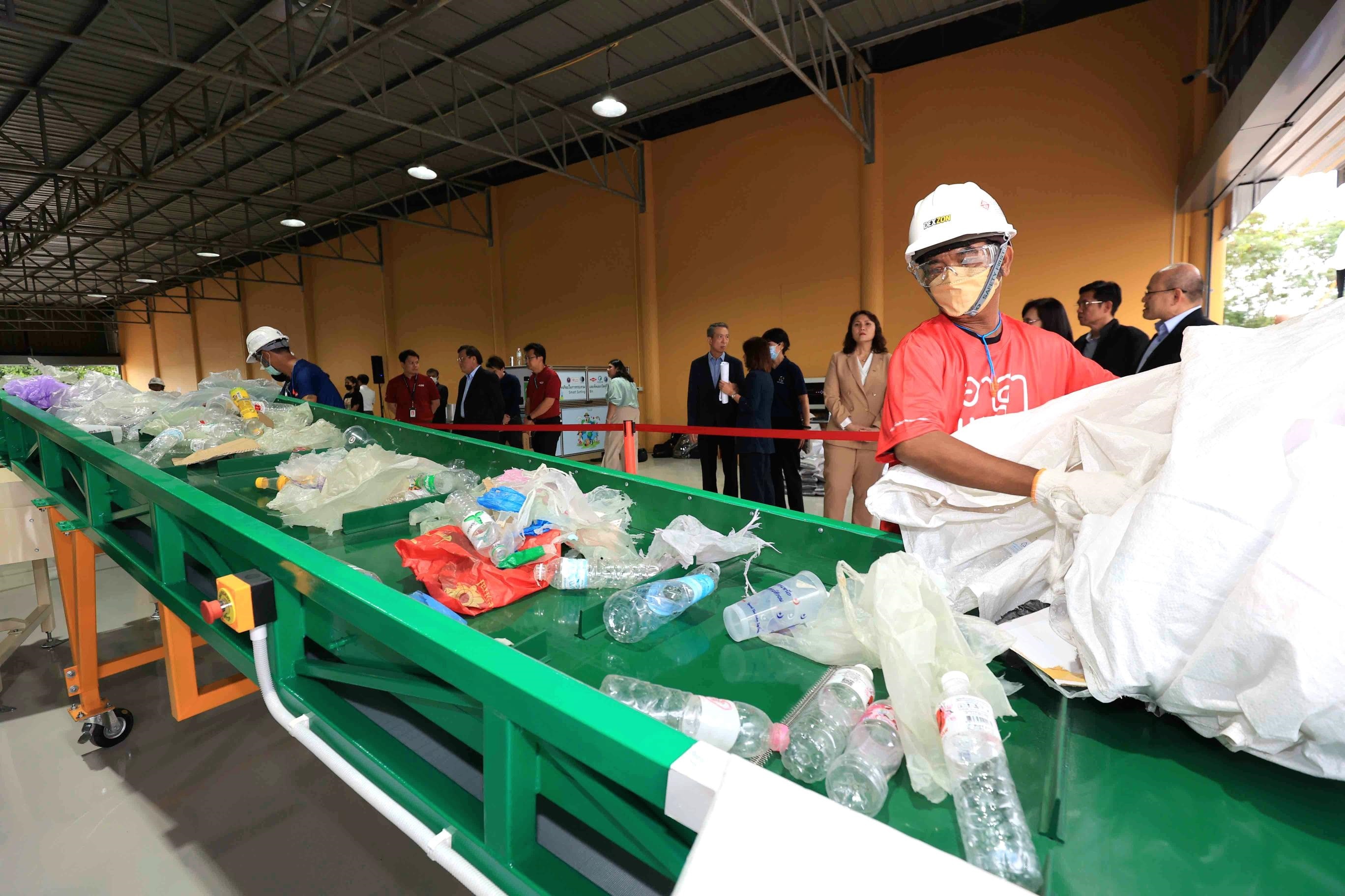 people sorting recycling